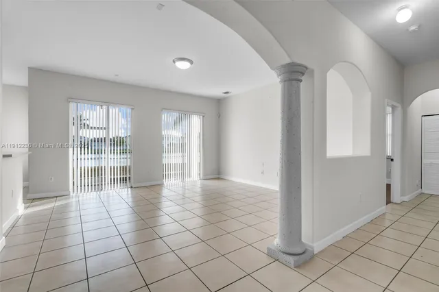 a view of an empty room and window