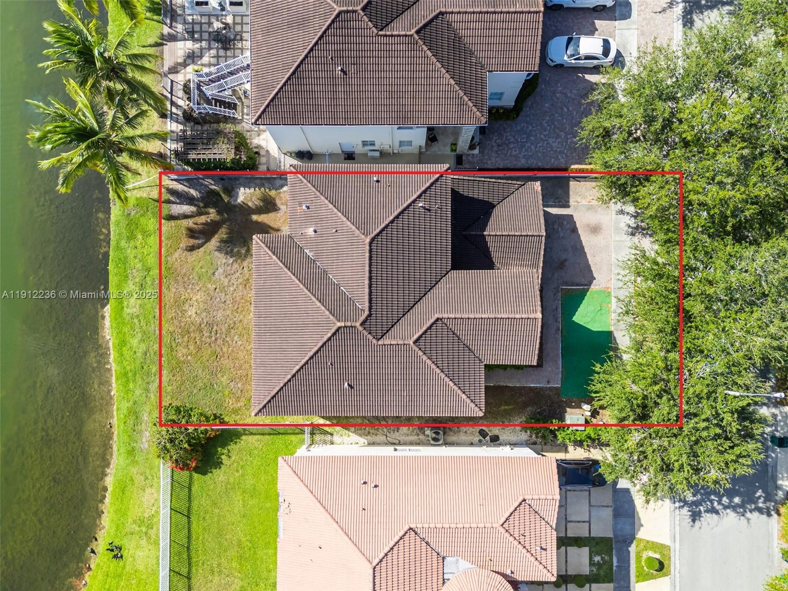 8920 Northwest 180th Terrace Hialeah, FL 33018 - Photo 43 of 44 an aerial view of a house with a yard