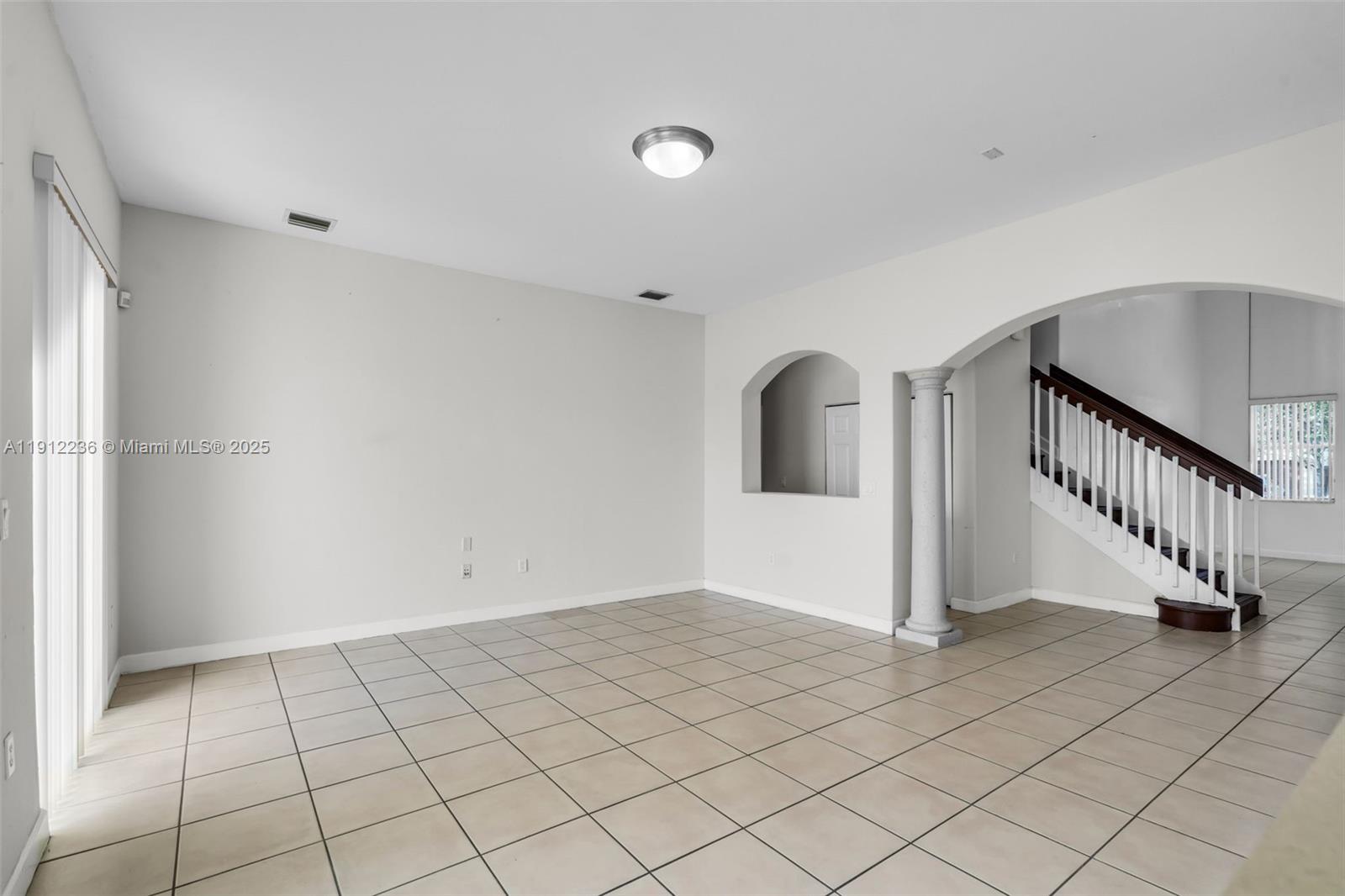8920 Northwest 180th Terrace Hialeah, FL 33018 - Photo 6 of 44 a view of an entryway with wooden floor