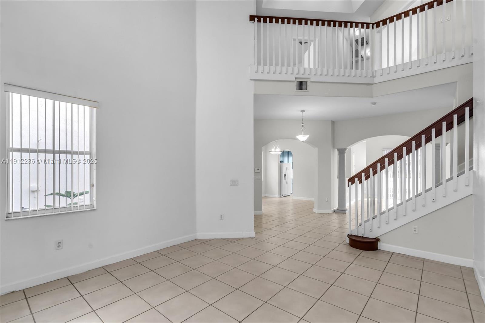 8920 Northwest 180th Terrace Hialeah, FL 33018 - Photo 9 of 44 a view of an entryway with wooden floor