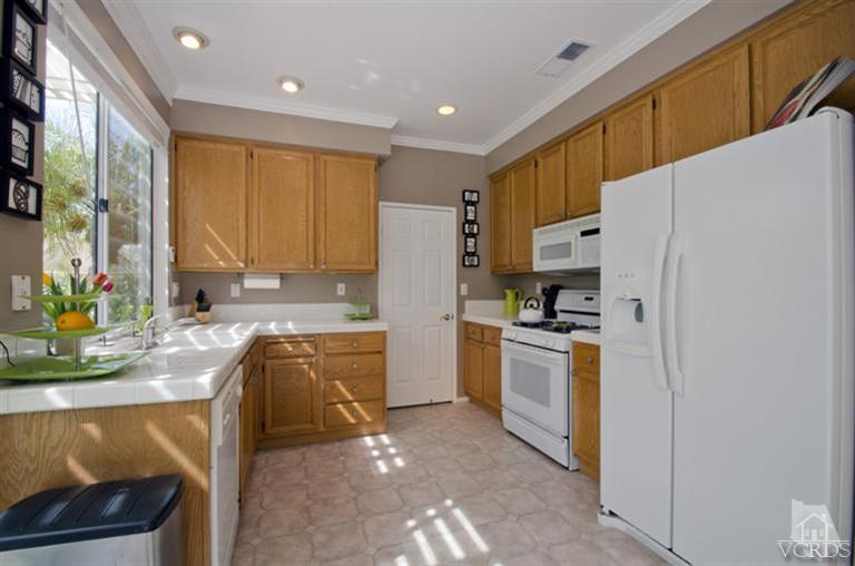 2364 Fitzgerald Road Simi Valley, CA 93065 - Photo 11 of 20 a kitchen with a sink a stove a refrigerator and a window