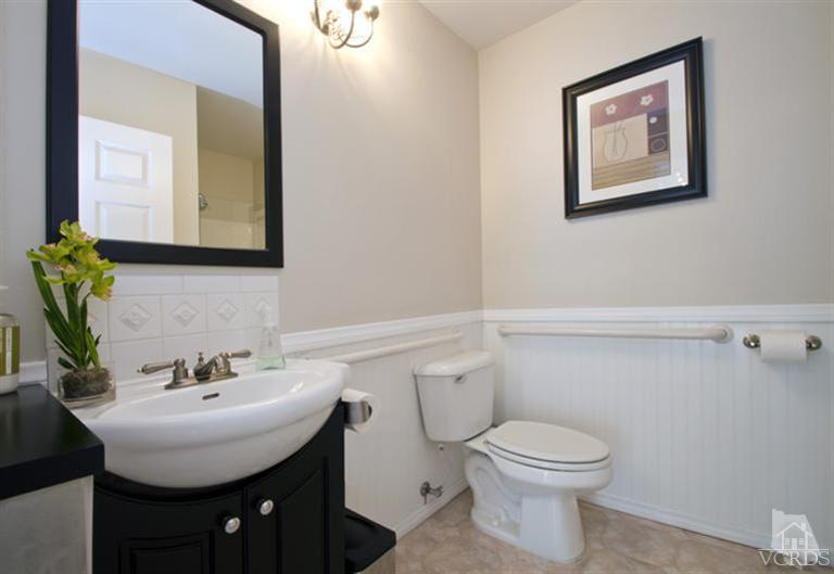 2364 Fitzgerald Road Simi Valley, CA 93065 - Photo 15 of 20 a bathroom with a toilet a sink and mirror