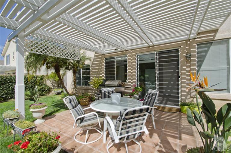 2364 Fitzgerald Road Simi Valley, CA 93065 - Photo 18 of 20 a view of a patio with table and chairs and potted plants