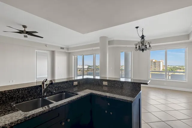 a view of a livingroom with an empty space and a window
