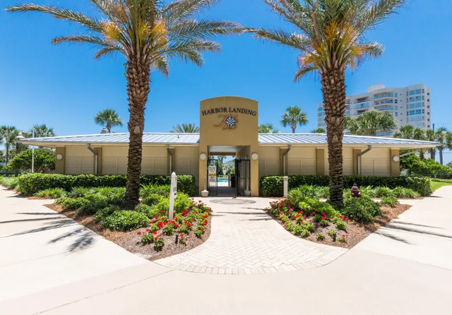 a front view of multi story residential apartment building with yard