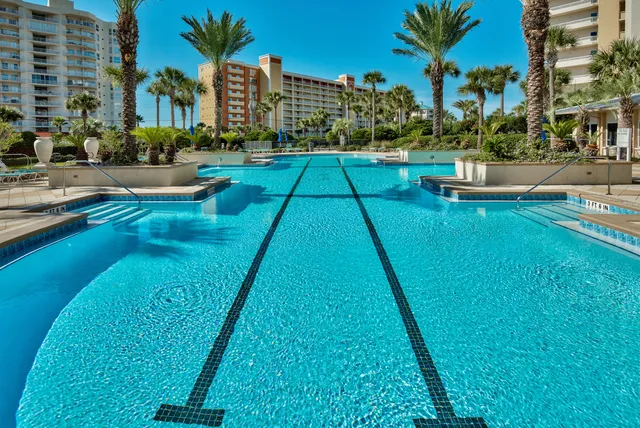 a view of a building with garden space and sitting area
