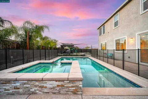 a view of a swimming pool with a patio