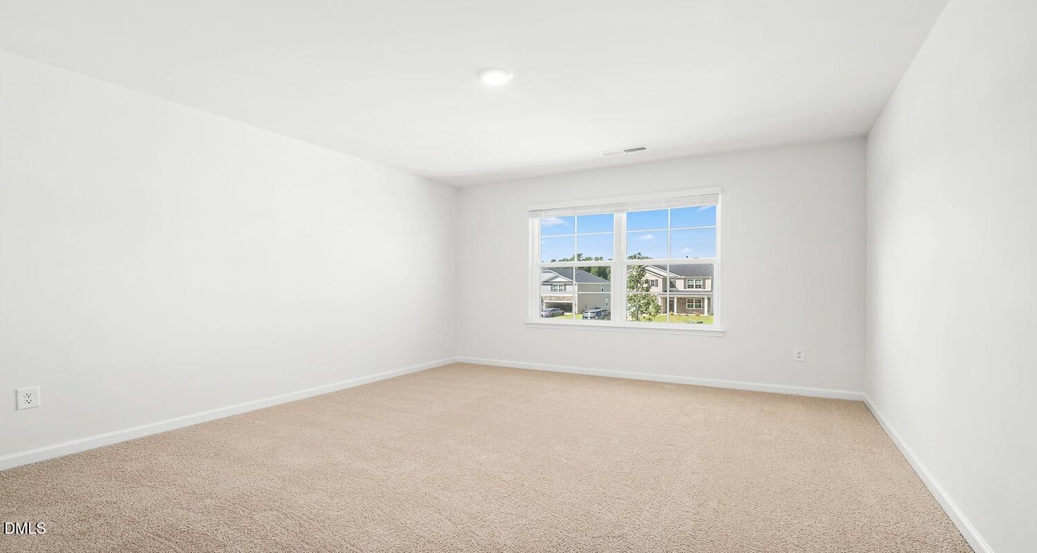 1383 Lansdowne Drive, Unit 401 Mebane, NC 27302 - Photo 14 of 23 an empty room with a window