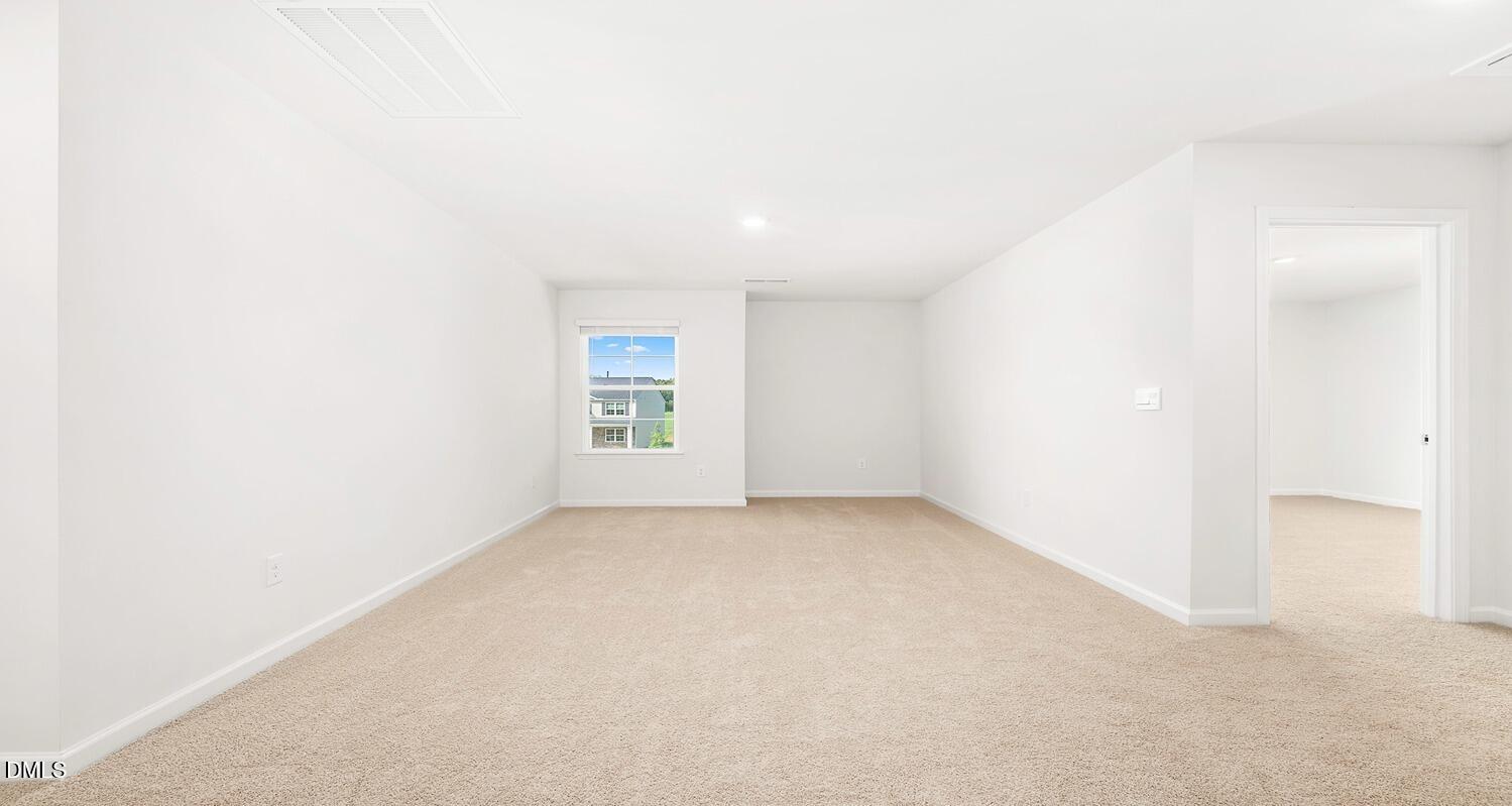 1383 Lansdowne Drive, Unit 401 Mebane, NC 27302 - Photo 15 of 23 an empty room with windows