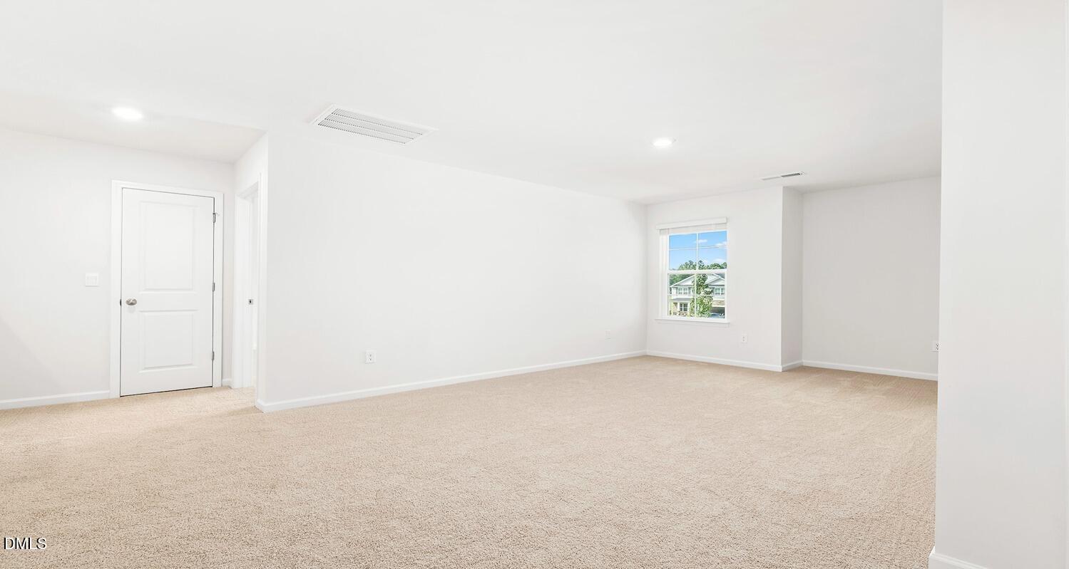 1383 Lansdowne Drive, Unit 401 Mebane, NC 27302 - Photo 16 of 23 an empty room with windows