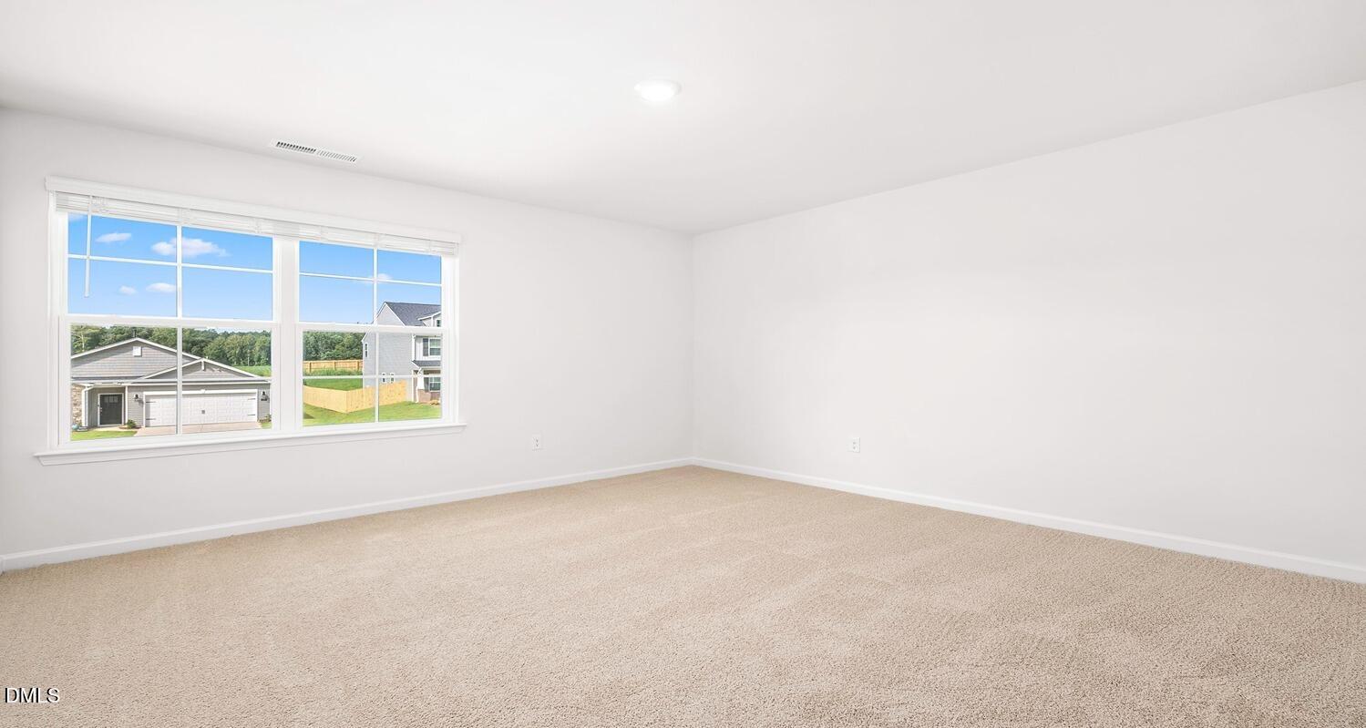 1383 Lansdowne Drive, Unit 401 Mebane, NC 27302 - Photo 17 of 23 an empty room with a window