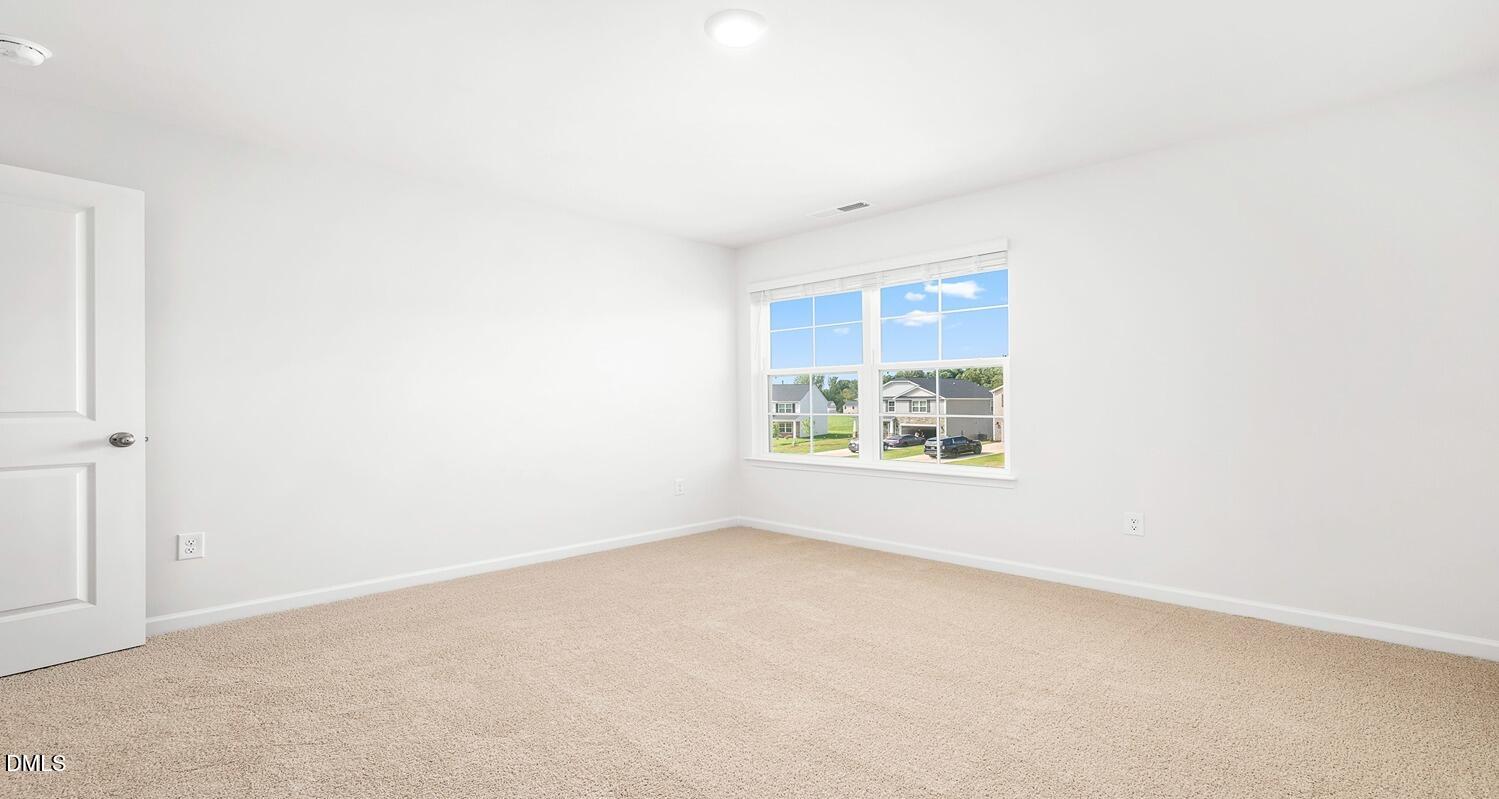 1383 Lansdowne Drive, Unit 401 Mebane, NC 27302 - Photo 18 of 23 an empty room with a window
