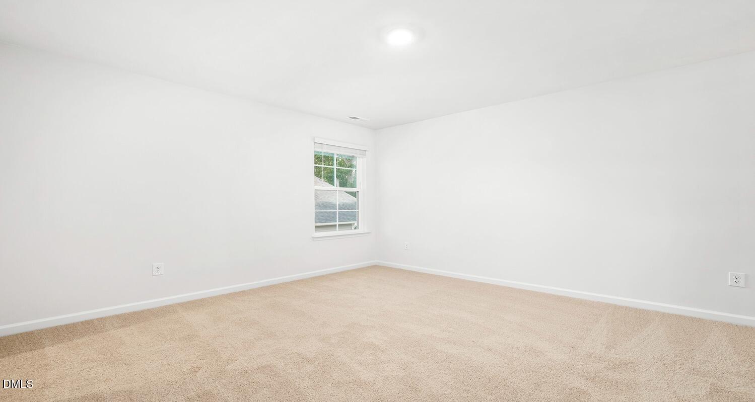 1383 Lansdowne Drive, Unit 401 Mebane, NC 27302 - Photo 19 of 23 an empty room with a window