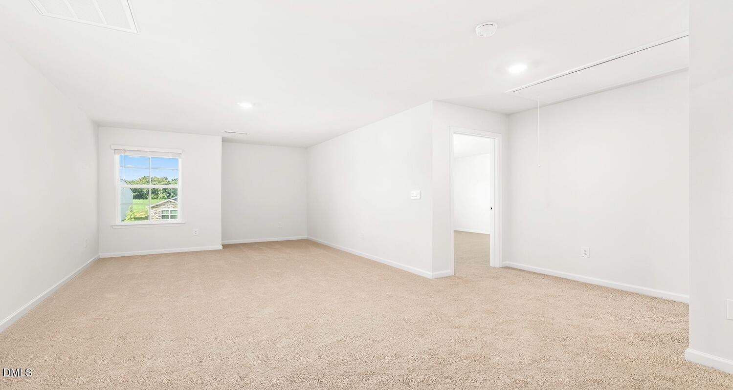 1383 Lansdowne Drive, Unit 401 Mebane, NC 27302 - Photo 21 of 23 an empty room with windows
