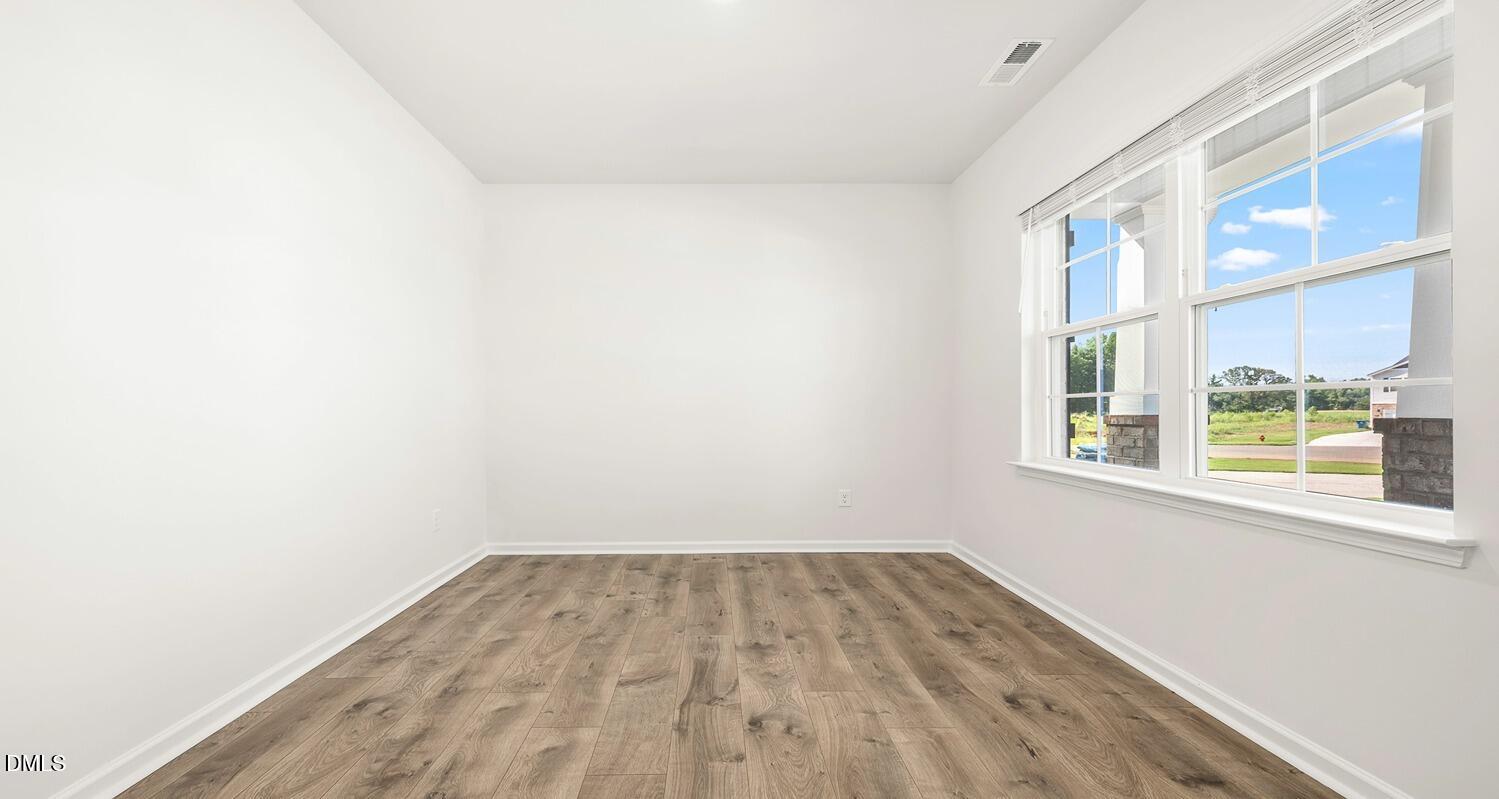 1383 Lansdowne Drive, Unit 401 Mebane, NC 27302 - Photo 2 of 23 a view of a room that has a window in it