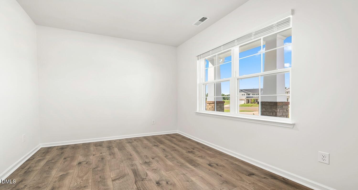 1383 Lansdowne Drive, Unit 401 Mebane, NC 27302 - Photo 3 of 23 an empty room with a window