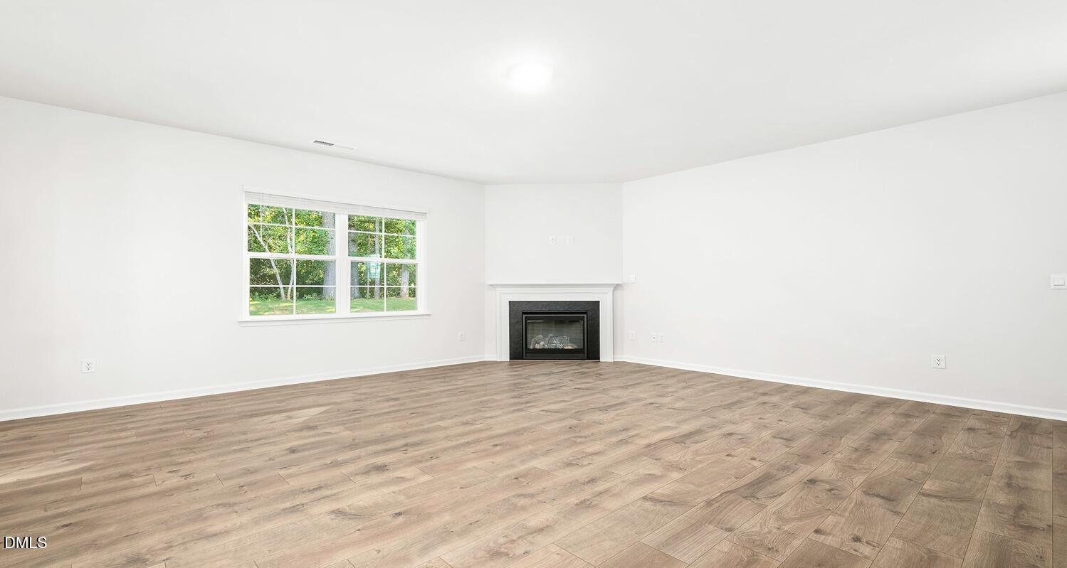 1383 Lansdowne Drive, Unit 401 Mebane, NC 27302 - Photo 6 of 23 an empty room with windows