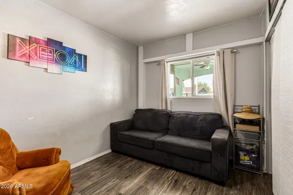 a living room with furniture and a window