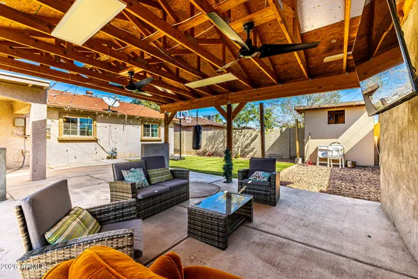 a outdoor space with patio lots of furniture and garden view