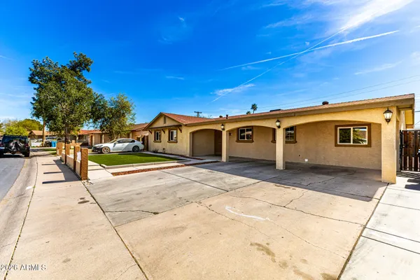 a view of a house with a street