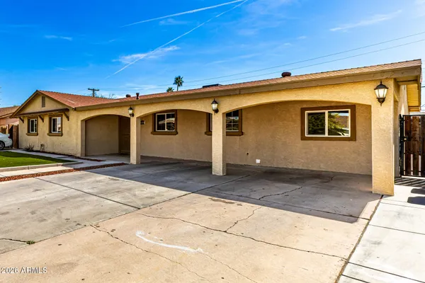 a front view of a house with a garage