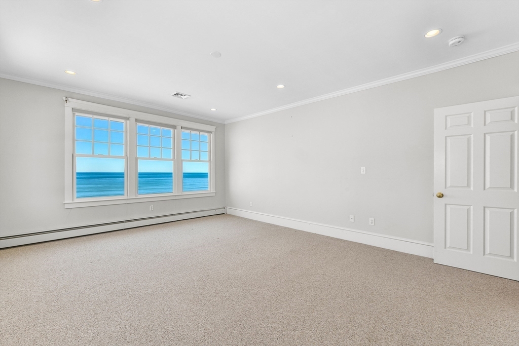 351 Beach Avenue Hull, MA 02045 - Photo 11 of 24 a view of an empty room with a window