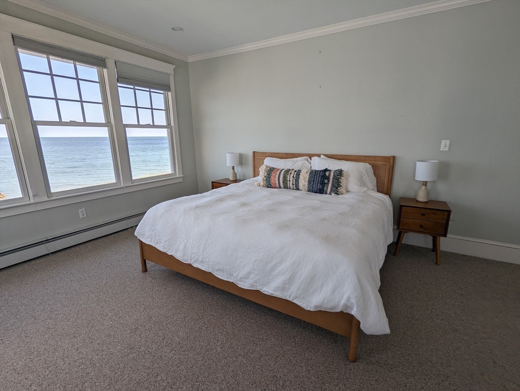 351 Beach Avenue Hull, MA 02045 - Photo 12 of 24 a bedroom with a bed chair and window