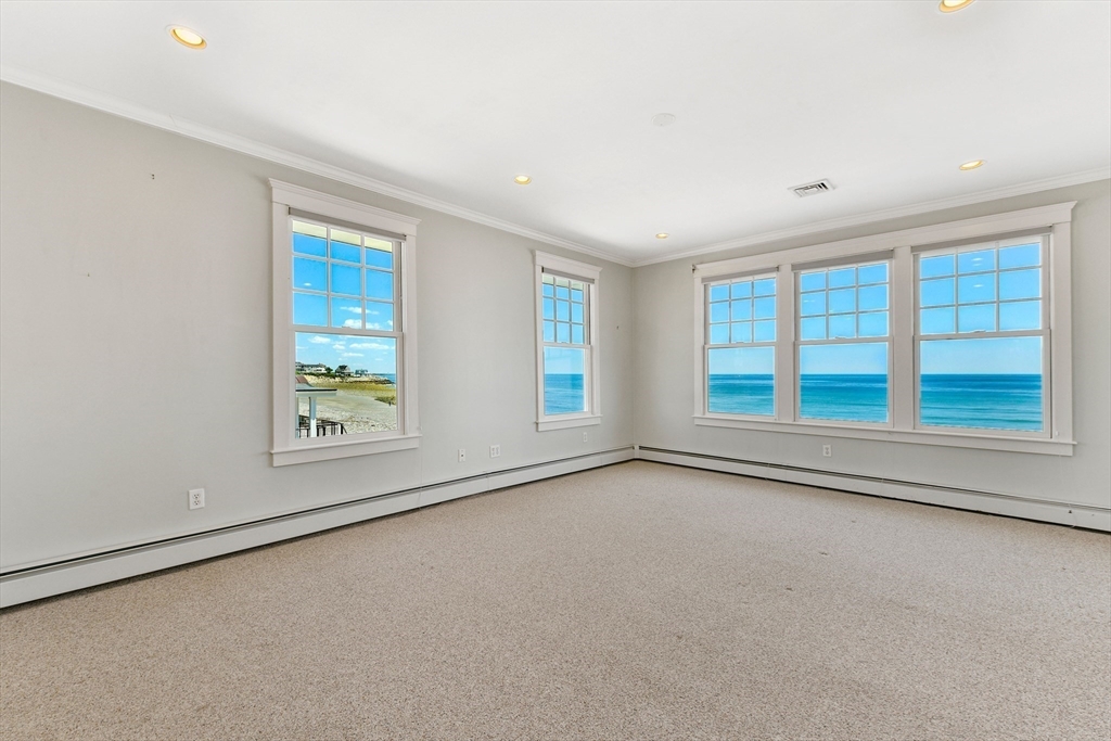 351 Beach Avenue Hull, MA 02045 - Photo 13 of 24 an empty room with windows