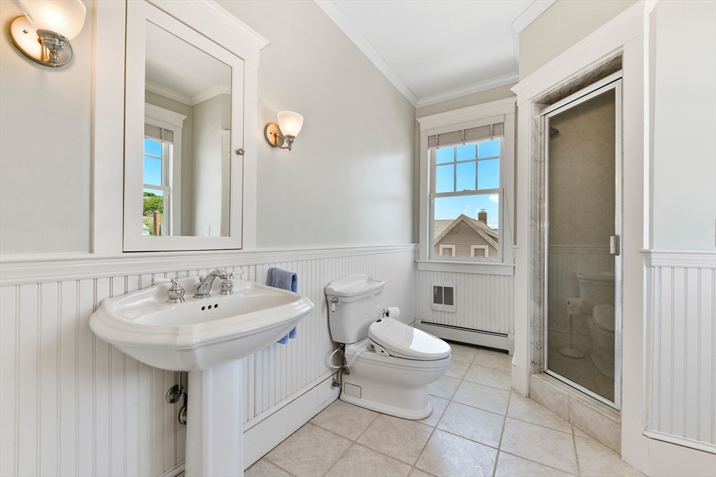 351 Beach Avenue Hull, MA 02045 - Photo 14 of 24 a bathroom with a toilet sink and mirror