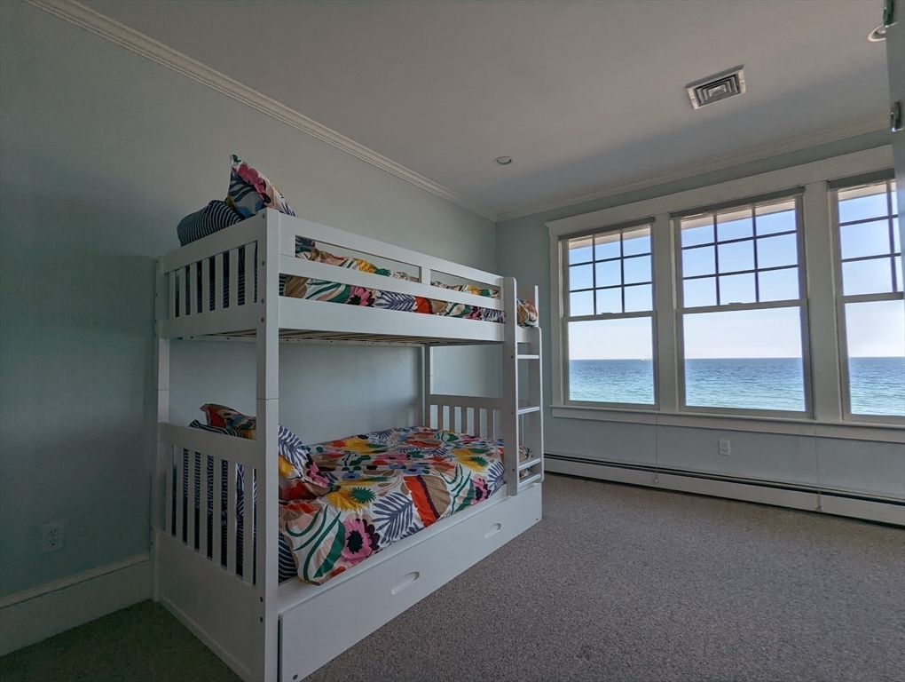 351 Beach Avenue Hull, MA 02045 - Photo 20 of 24 a bedroom with furniture and a window