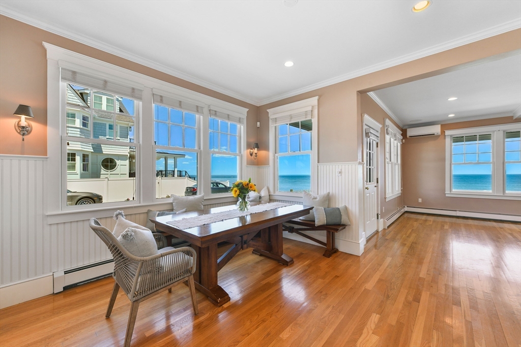 351 Beach Avenue Hull, MA 02045 - Photo 5 of 24 a view of a dining room with furniture and wooden floor