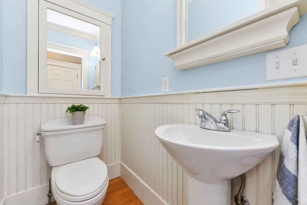 351 Beach Avenue Hull, MA 02045 - Photo 10 of 24 a bathroom with a toilet a sink and a mirror