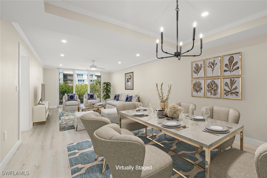 200 Periwinkle Way, Unit 132 Sanibel, FL 33957 - Photo 11 of 44 a living room with furniture kitchen view and a wooden floor