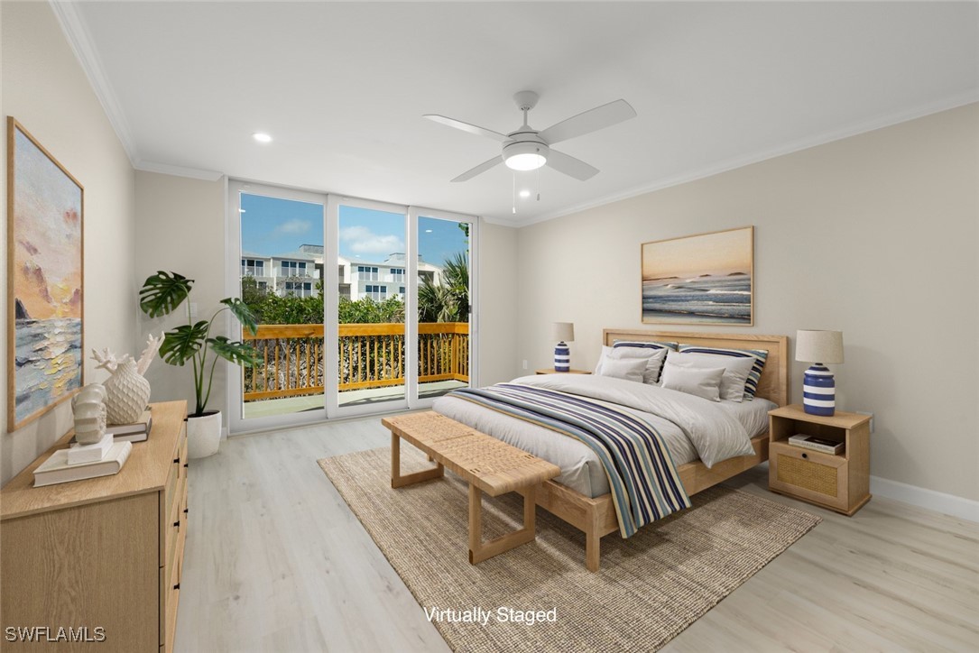 200 Periwinkle Way, Unit 132 Sanibel, FL 33957 - Photo 26 of 44 a spacious bedroom with a large bed and a large window
