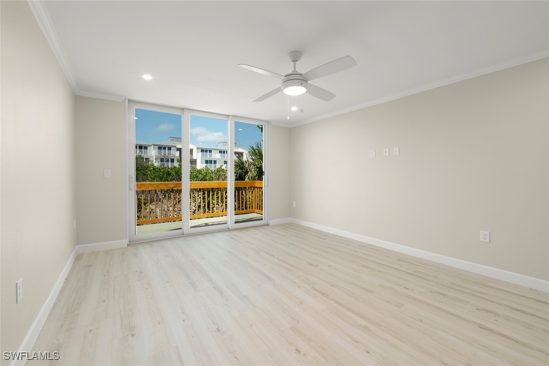 200 Periwinkle Way, Unit 132 Sanibel, FL 33957 - Photo 27 of 44 wooden floor in an empty room with a window