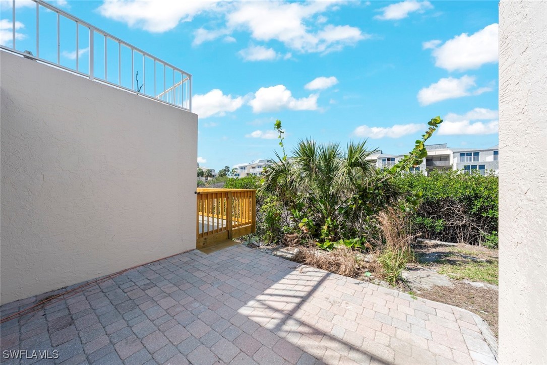 200 Periwinkle Way, Unit 132 Sanibel, FL 33957 - Photo 34 of 44 a view of a house with yard and sitting area