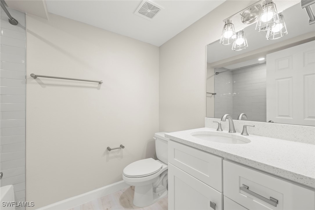 200 Periwinkle Way, Unit 132 Sanibel, FL 33957 - Photo 38 of 44 a bathroom with a sink a toilet and a mirror