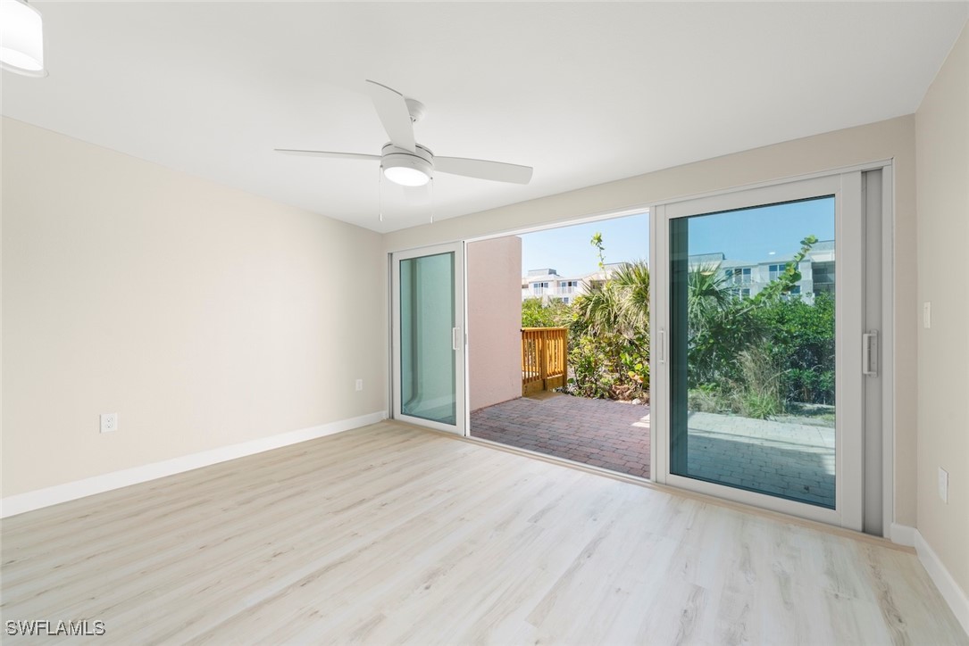 200 Periwinkle Way, Unit 132 Sanibel, FL 33957 - Photo 9 of 44 a view of entryway with wooden floor