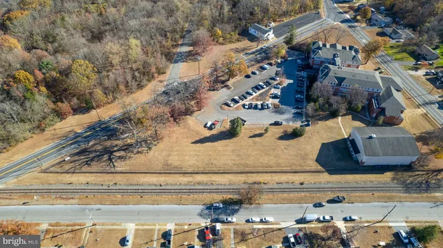 a kitchen with stainless steel appliances granite countertop a refrigerator a sink dishwasher a stove and a refrigerator