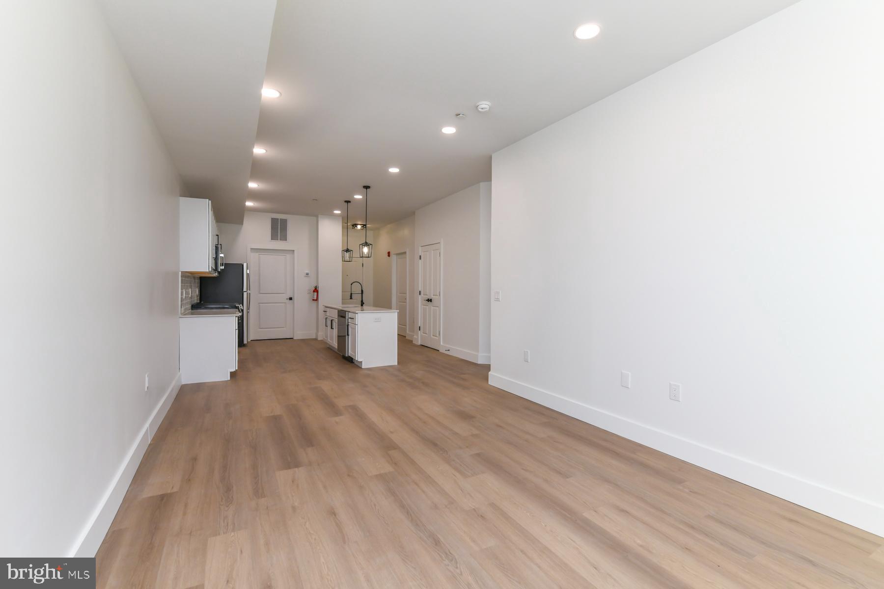 100 Aura Road, Unit 111 Clayton, NJ 08312 - Photo 25 of 34 a view of a kitchen with a refrigerator and a window