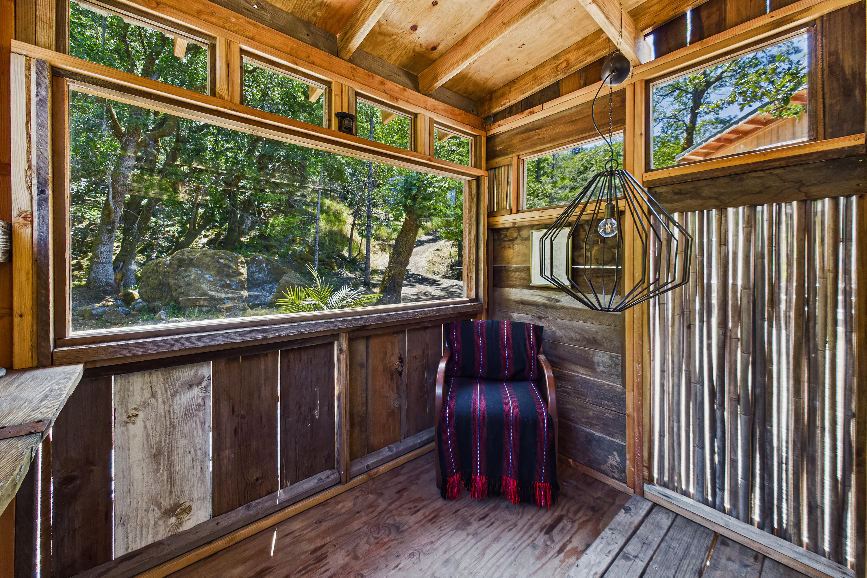 60890 Bell Springs Road Laytonville, CA 95454 - Photo 30 of 77 a view of a porch with wooden floor and furniture