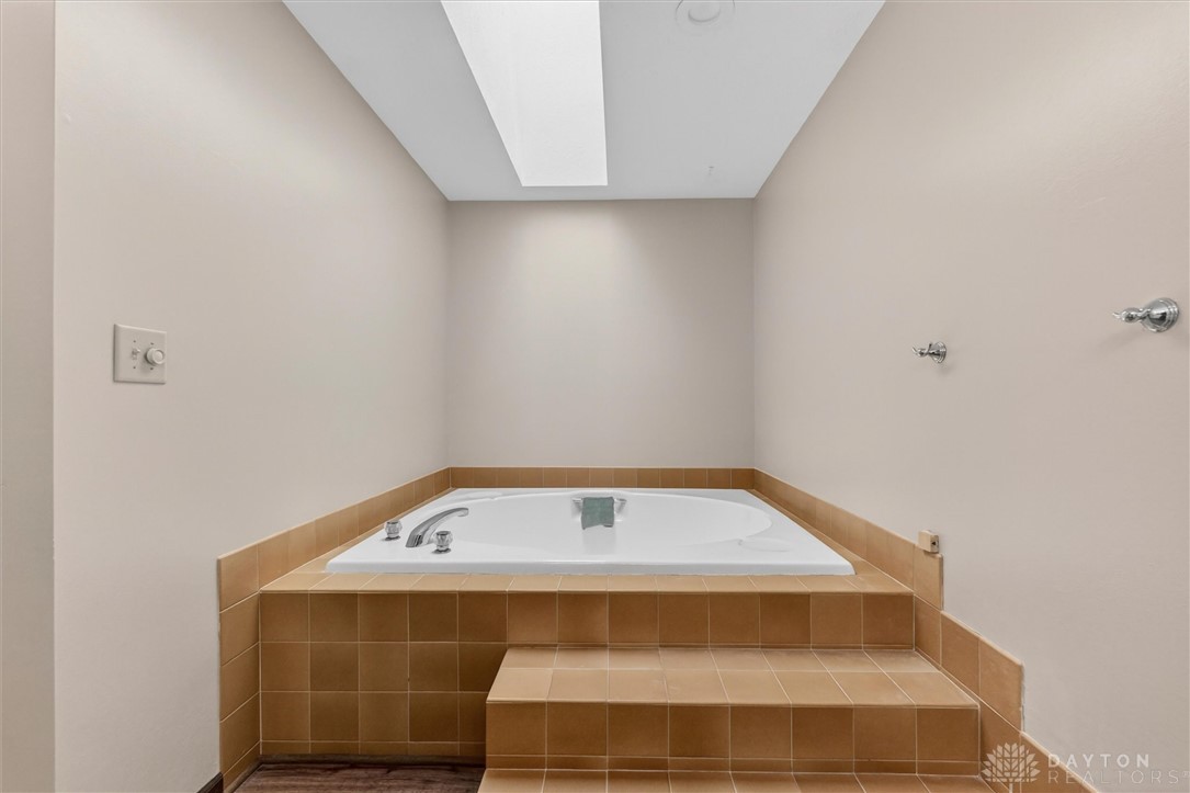 2165 Stewart Road Xenia, OH 45385 - Photo 36 of 59 Relax and unwind in this serene bathroom featuring a spacious soaking tub.