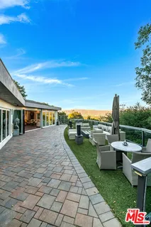 a kitchen with stainless steel appliances granite countertop a stove oven and a refrigerator