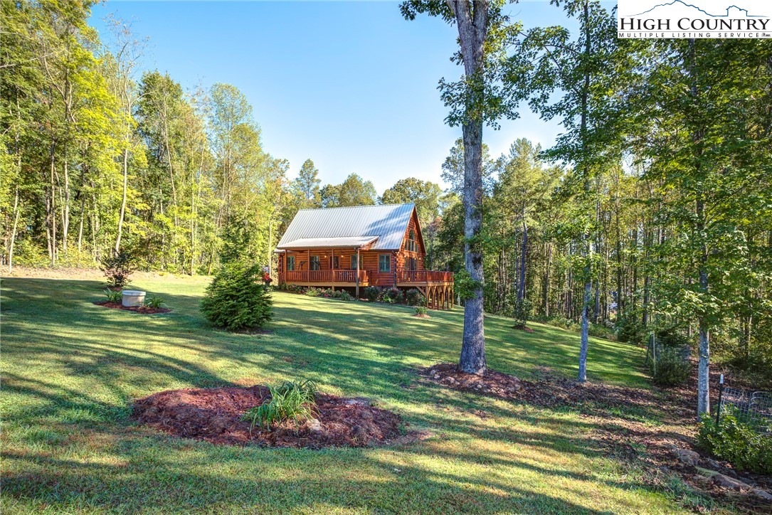 3460 South Center Church Road Thurmond, NC 28683 - Photo 5 of 50 a view of a house with a yard