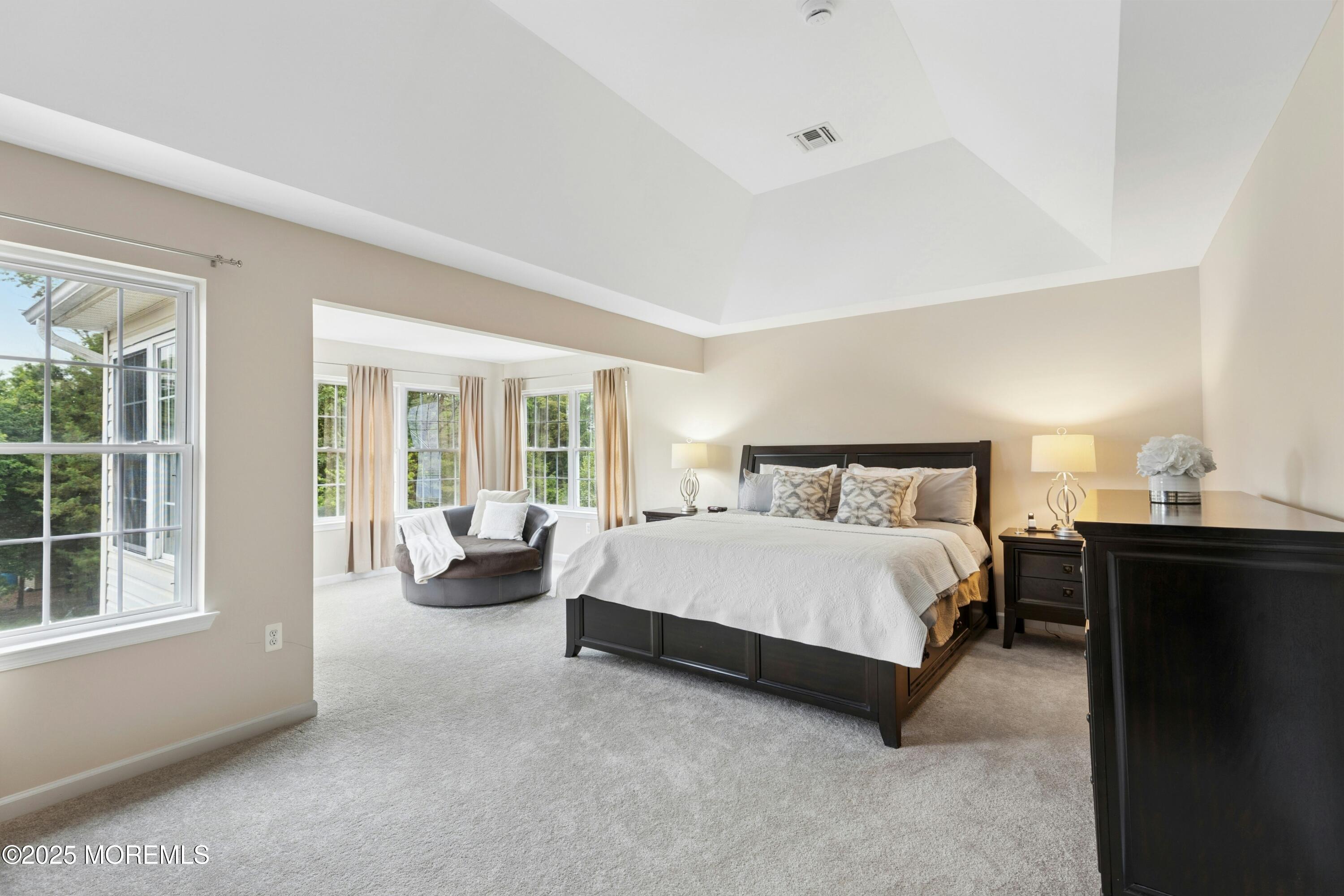 7 Topaz Drive Jackson, NJ 08527 - Photo 26 of 51 a spacious bedroom with a bed and a couch