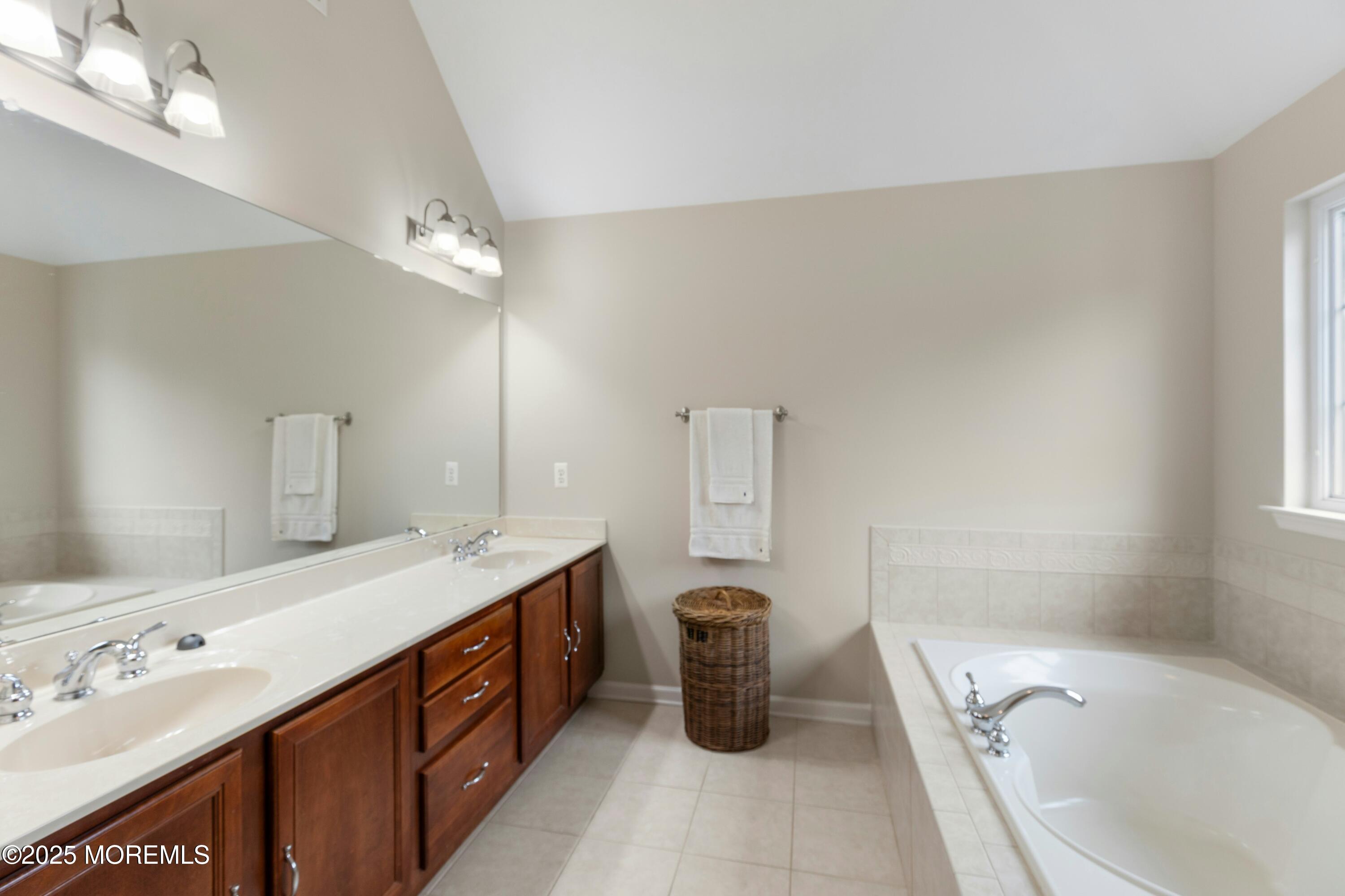 7 Topaz Drive Jackson, NJ 08527 - Photo 30 of 51 a spacious bathroom with a tub sink and mirror