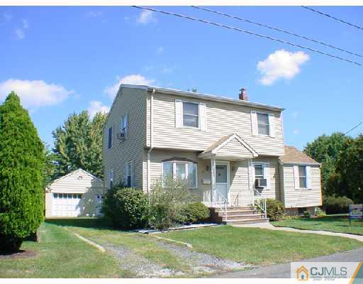 21 Rector Avenue Woodbridge, NJ 07095 - Photo 1 of 2 a front view of a house with a yard