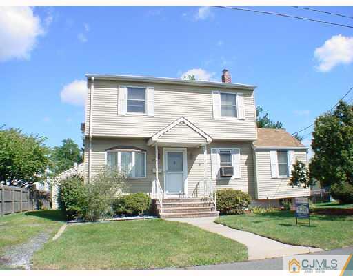 21 Rector Avenue Woodbridge, NJ 07095 - Photo 2 of 2 a front view of a house with a yard