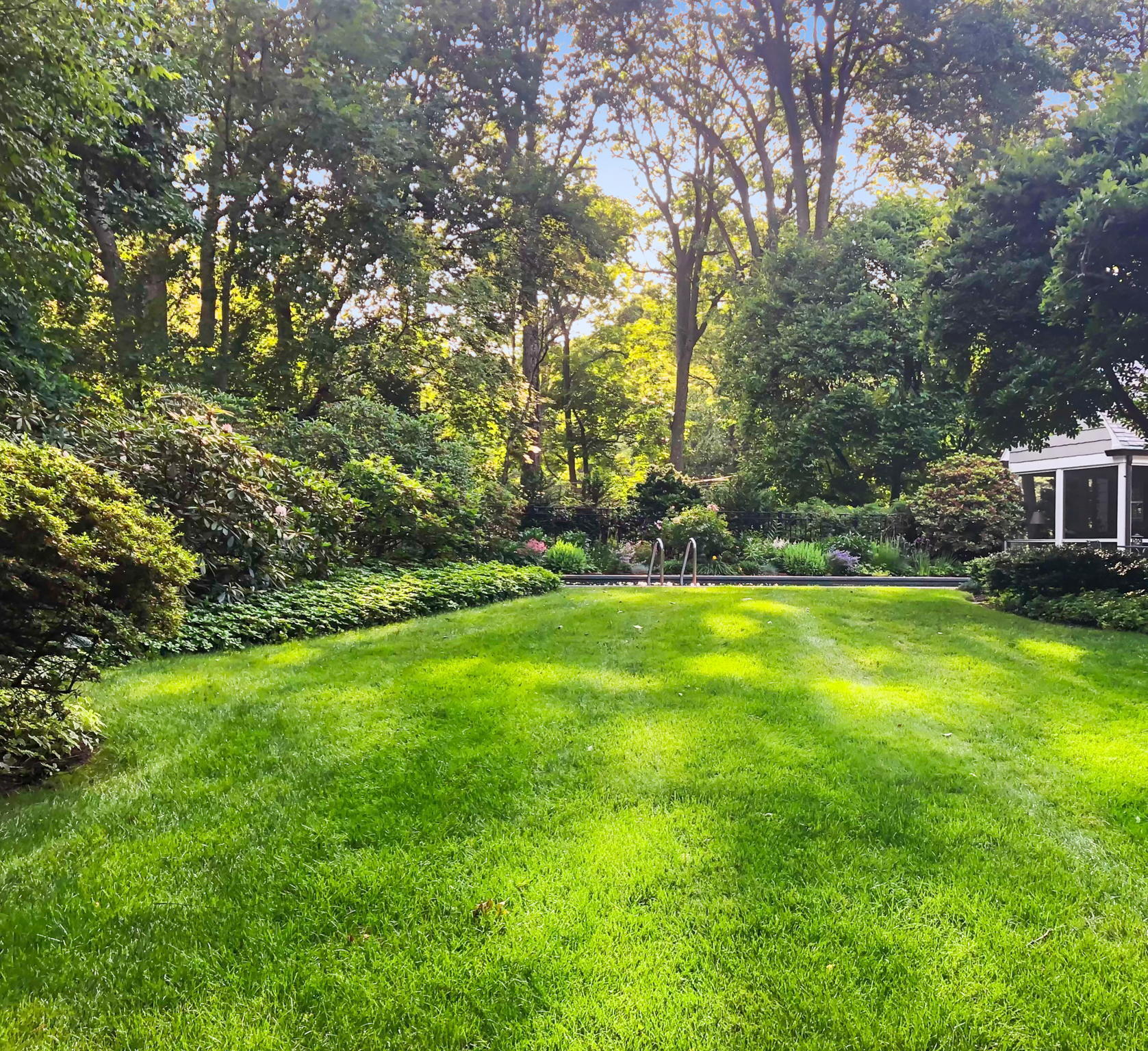 7 Point O Woods Road South Darien, CT 06820 - Photo 11 of 33 a view of yard with swimming pool and green space