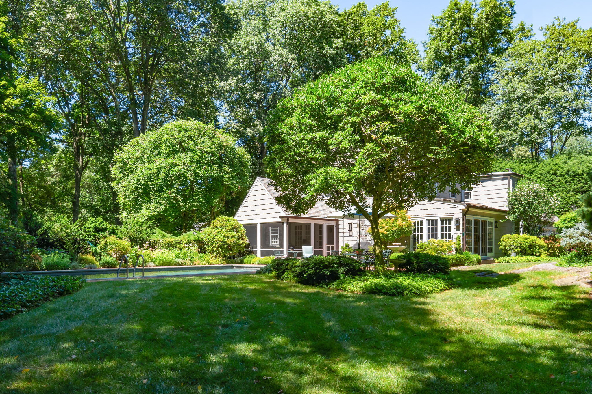 7 Point O Woods Road South Darien, CT 06820 - Photo 12 of 33 a view of a house with a yard and sitting area
